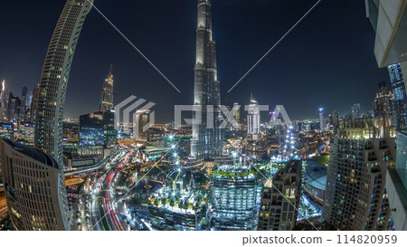 Panoramic skyline view of Dubai downtown with mall, fountains and skyscrapers aerial night timelapse Panoramic skyline view of Dubai downtown with mall, fountains and skyscrapers aerial night timelapse 114820959