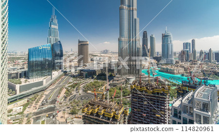 Panoramic skyline view of Dubai downtown with mall, fountains and skyscrapers aerial timelapse Panoramic skyline view of Dubai downtown with mall, fountains and skyscrapers aerial timelapse 114820961