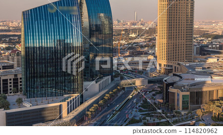 Dubai downtown street with busy traffic and skyscrapers around timelapse. 114820962
