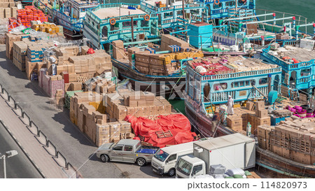 Loading a ship in port timelapse in Dubai, Deira creek, UAE. Loading a ship in port timelapse in Dubai, Deira creek, UAE. 114820973