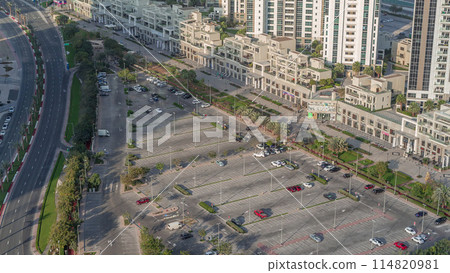 Aerial view full cars at large outdoor parking lots timelapse in Dubai, UAE. 114820981