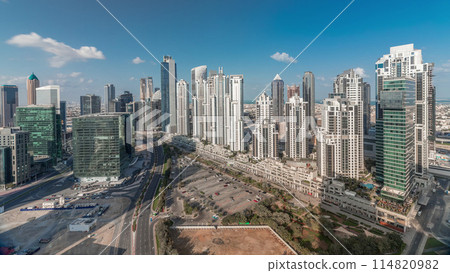 Modern residential and office complex with many towers aerial timelapse at Business Bay, Dubai, UAE. 114820982
