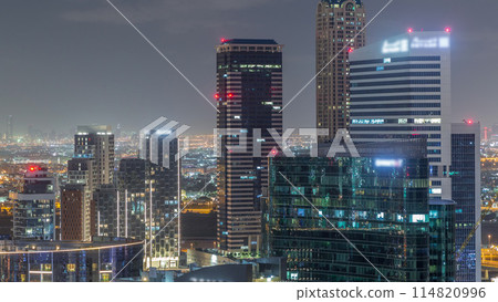 Dubai's business bay towers aerial night timelapse. 114820996