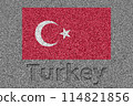 The Turkish flag painted on a stone slab with the word "Turkey" carved into it 114821856