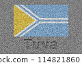 The Tuvan flag painted on a stone slab with the word "Tuva" carved into it 114821860