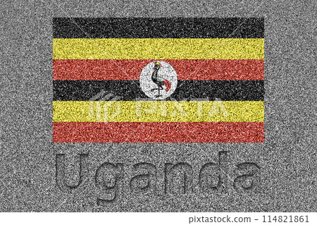 The Ugandan flag painted on a stone slab with the word "Uganda" carved into it 114821861