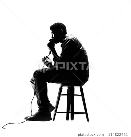 Black silhouette of a sitting boy with a microphone on white background. 114822431