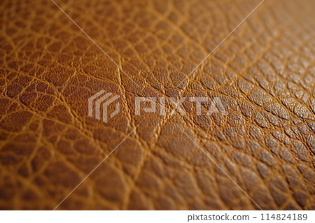 Detailed close up of vegan leather texture with natural patterns and warm brown tones 114824189