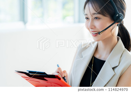 Female operator working in the office Female operator working in the office 114824970