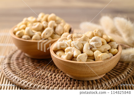 Raw cashew nuts in wooden bowl, Food ingredient Raw cashew nuts in wooden bowl, Food ingredient 114825848