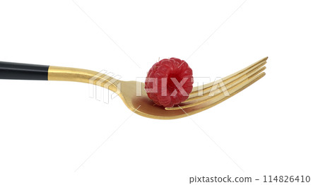 Ripe raspberry on a golden fork isolated on white background 114826410