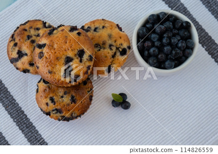 Homemade baked blueberry muffins with fresh blackberries. Tasty pastry sweet cupcake dessert. Berry pie cupcakes with organic berries. Gluten free healthcare recipe from alternative flour  114826559