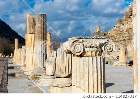 Remains of State Agora colonnade on background of Odeon in Ephesus Remains of State Agora colonnade on background of Odeon in Ephesus 114827317