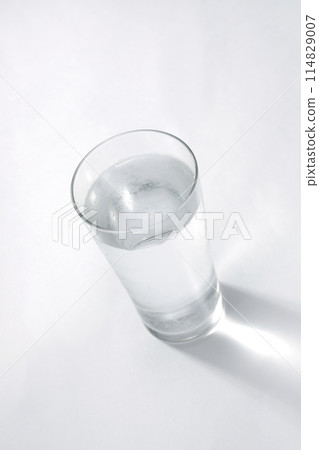 Water poured into a glass 114829007