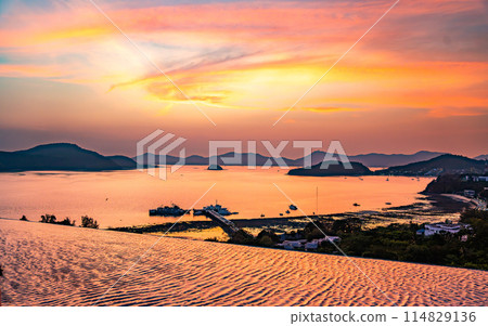 View of Cape Panwa beach at sunset, in Phuket, Thailand View of Cape Panwa beach at sunset, in Phuket, Thailand 114829136