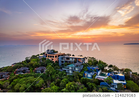 View of resort in Panwa beach at sunset, in Phuket, Thailand View of resort in Panwa beach at sunset, in Phuket, Thailand 114829163