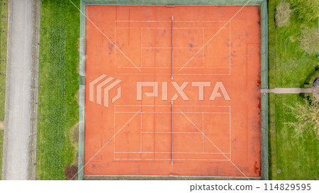 Aerial view of tennis court with wood flooring and brickwork Aerial view of tennis court with wood flooring and brickwork 114829595