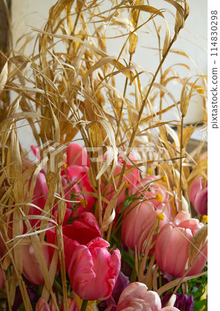 Bunch of pink tulips on a table. Bunch of pink tulips on a table. 114830298