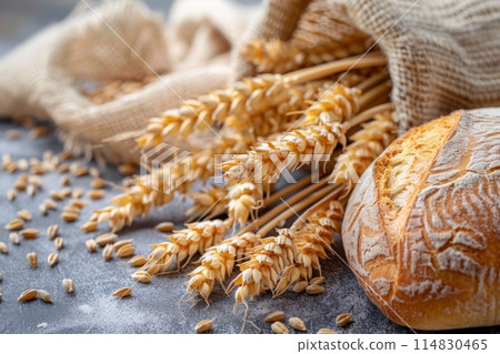 The concept of baking bread. Various breads and wheat varieties displayed on the table 114830465