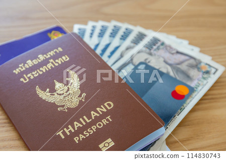 Passport, airline tickets or boarding pass, cash and credit cards for international business and leisure travel. 114830743