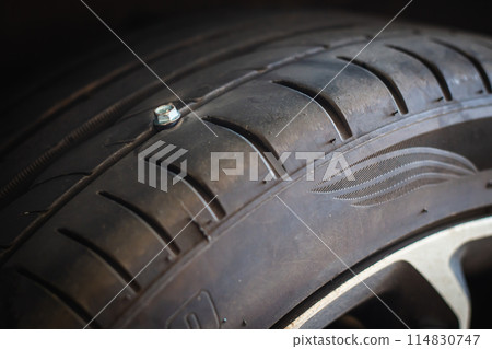 The nut pokes the tire causing a leak and must be removed and repaired. 114830747