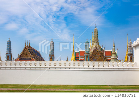 Temple Wat Phra Kaew is in the Royal Palace of Bangkok, Thailand. It is a popular place and destination for tourists around the world. 114830751