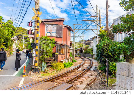 Kamakura's famous cafe next to the train tracks, sit or stand and eat food or drink and watch the trains pass by up close Japan Kamakura's famous cafe next to the train tracks, sit or stand and eat food or drink and watch the trains pass by up close Japan 114831344