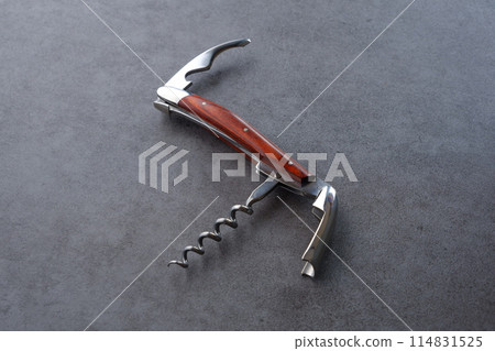 A sommelier knife for opening wine bottle corks 114831525