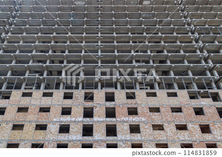 large multi-storey apartment building is under construction 114831859