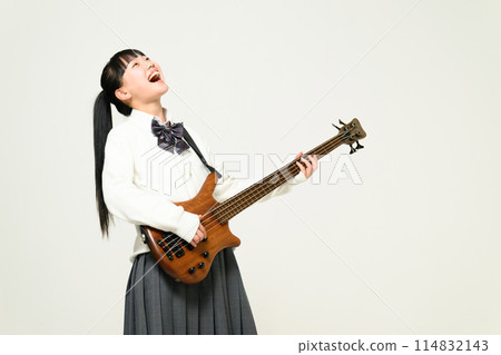 High school girl playing bass 114832143