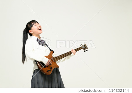 High school girl playing bass 114832144