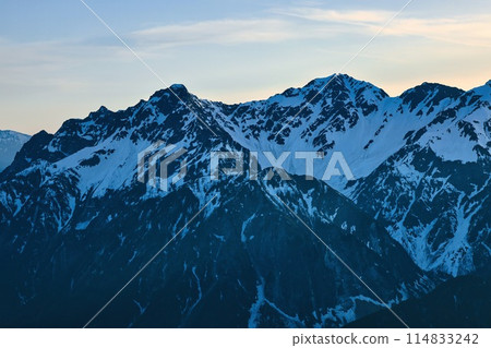 Snow-capped Mount Maehotaka and Mount Okuhotaka in the Northern Alps at sunset Snow-capped Mount Maehotaka and Mount Okuhotaka in the Northern Alps at sunset 114833242