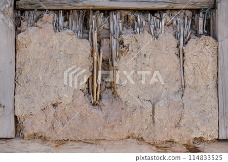 old damaged wattle and daub covered window, full-frame background and texture old damaged wattle and daub covered window, full-frame background and texture 114833525
