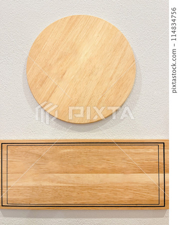 Blank wooden sign on a cement wall for text as a background and as an illustration. 114834756