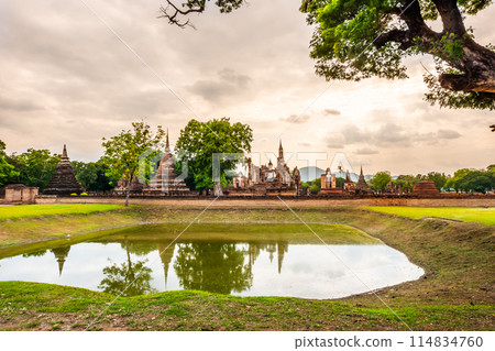 Landscape of Buddha statue and pagoda in Wat Mahathat temple Sukhothai Historical Park, Thailand Landscape of Buddha statue and pagoda in Wat Mahathat temple Sukhothai Historical Park, Thailand 114834760