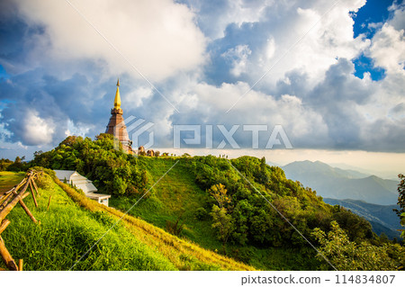 Beautiful landscape aerial view of Doi Inthanon in evening time with blue sky background buddhist stupa landmark tourism at Chiang Mai of north Thailand. Beautiful landscape aerial view of Doi Inthanon in evening time with blue sky background buddhist stupa landmark tourism at Chiang Mai of north Thailand. 114834807