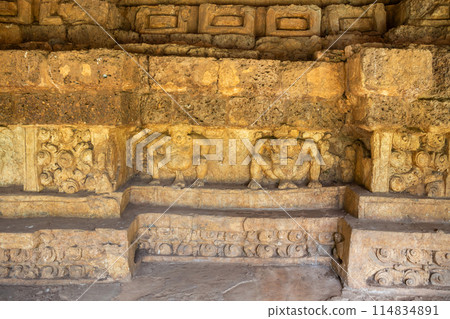 Ancient stone carvings depicting legendary animals or deities on a Dvaravati period stone wall in Si Thep Historical Park, Phetchabun, Thailand, registered as a World Heritage Site. 114834891