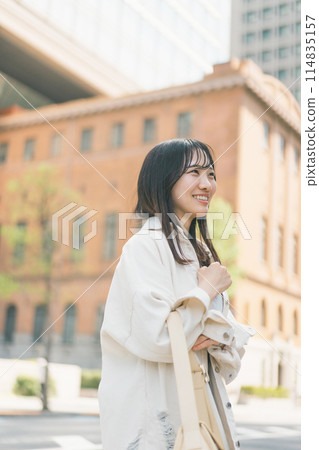 Young woman walking around the city Young woman walking around the city 114835157