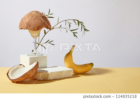 Photo for advertise product extracted tropical fruits with a blank plaster platform for showing product. Banana and coconut are common ingredients in manufacturing cosmetic, culinary and beverage Photo for advertise product extracted tropical fruits with a blank plaster platform for showing product. Banana and coconut are common ingredients in manufacturing cosmetic, culinary and beverage 114835218