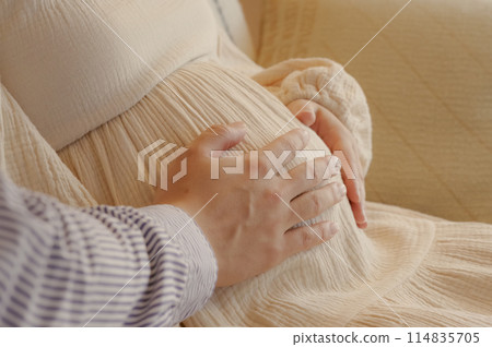 A couple stroking their baby A couple stroking their baby 114835705