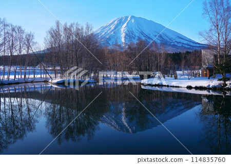 Winter in Kutchan, Abuta-gun, Hokkaido - View of Mt. Yotei from Yotei Sugatami Pond in the early morning Winter in Kutchan, Abuta-gun, Hokkaido - View of Mt. Yotei from Yotei Sugatami Pond in the early morning 114835760