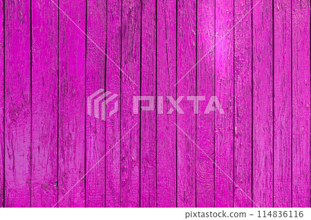 Close up of a vibrant pink wooden fence with hints of violet and magenta shades Close up of a vibrant pink wooden fence with hints of violet and magenta shades 114836116