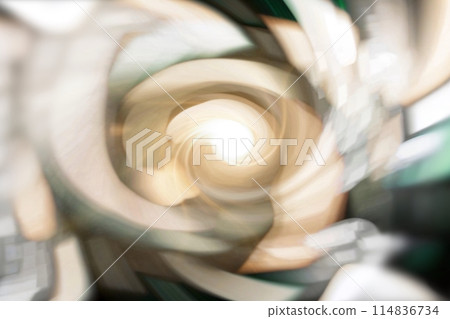 A vortex of tan, beige, white, and grey colors. The colors are blurred, creating sense of movement and energy.  114836734