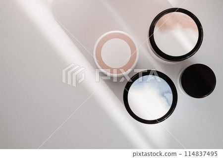 Flat lay with blue clay facel mask in jar. Beauty background with facial cosmetic products. Spa concept. Beauty blogger, salon treatments concept. Minimalism. 114837495