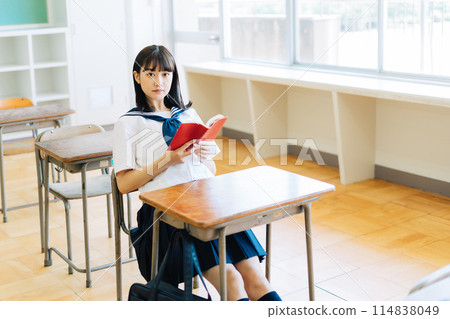 High school students reading in the classroom 114838049