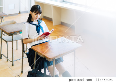 High school students reading in the classroom High school students reading in the classroom 114838060