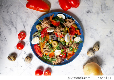 nicoise salad with tuna on the table with vegetables top view 114838144