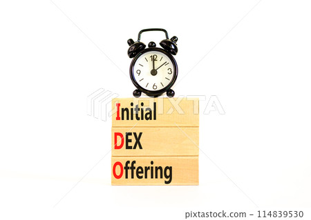 IDO initial DEX offering symbol. Concept words IDO initial DEX offering on beautiful wooden blocks. Beautiful white background. Alarm clock. Business IDO initial DEX offering concept. Copy space. 114839530
