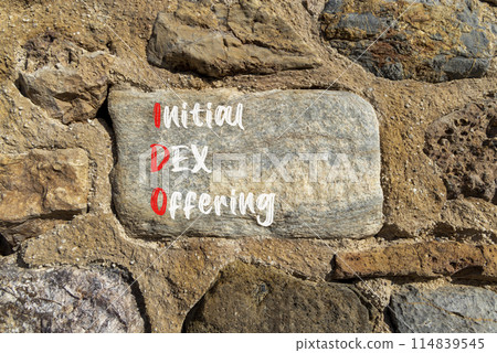 IDO initial DEX offering symbol. Concept words IDO initial DEX offering on beautiful big stone. Beautiful stone wall background. Business IDO initial DEX offering concept. Copy space. 114839545