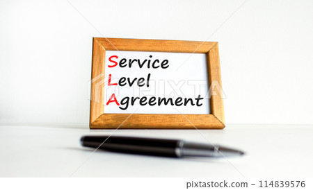 SLA service level agreement symbol. Concept words SLA service level agreement on beautiful wooden frame. Beautiful white background. Business SLA service level agreement concept. Copy space. 114839576